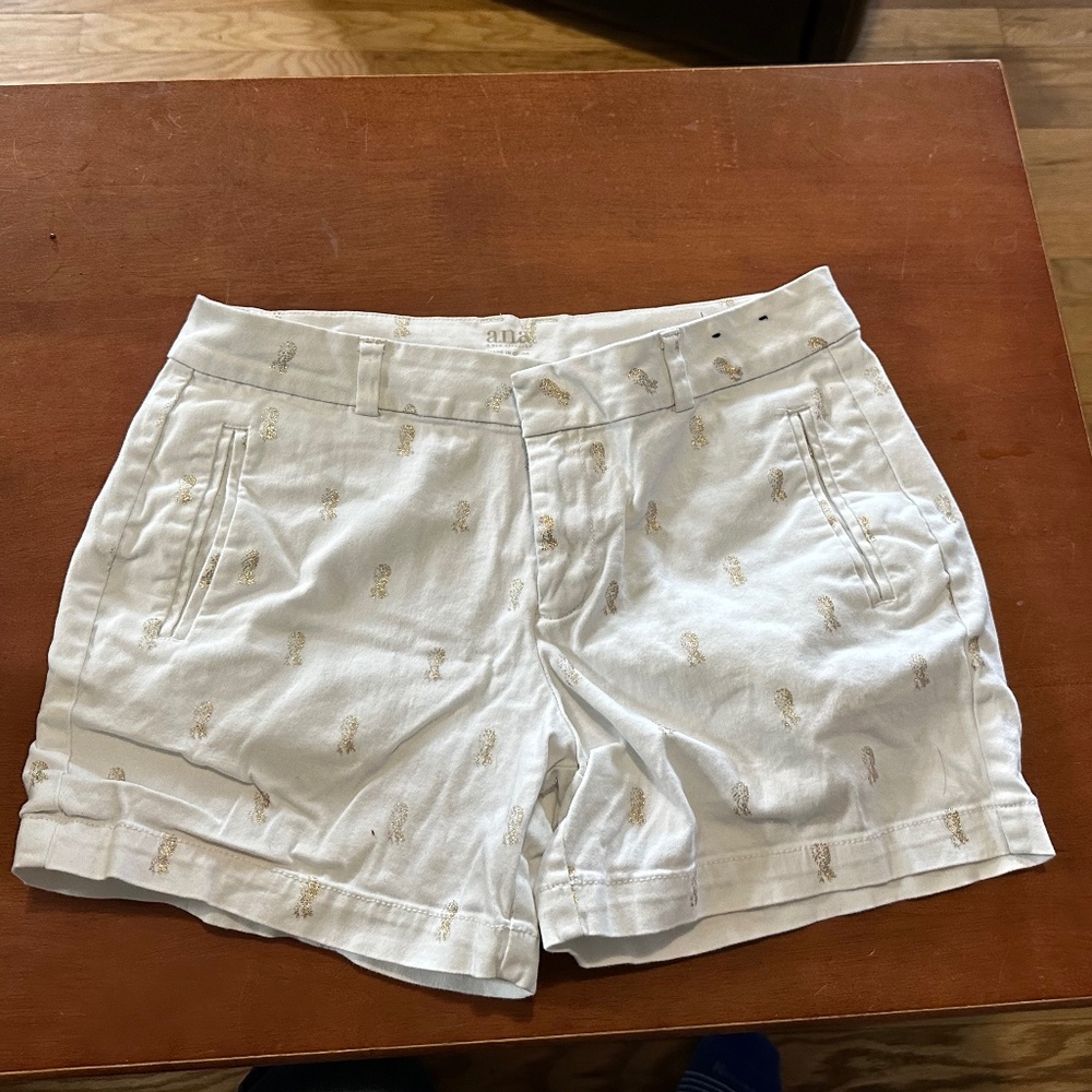 White shorts with gold glitter design